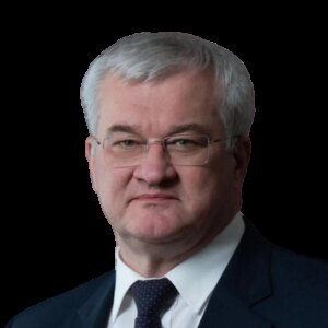 Официальный портрет мужчины с седыми волосами в очках и тёмном костюме